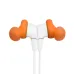 Close-up view of white JBL Endurance Run 2 Wireless earbuds with orange ear tips