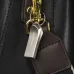 Lifestyle view of TEAM C222 32GB Pen Drive attached to keyring on leather bag zipper pull for portable use.