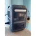 Side view of Anker SOLIX C300 Portable Power Station near wall outlet showing AC, USB, car socket, and display screen.
