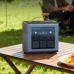 Portable Marsriva 600W power station placed on outdoor table, ideal for camping with multiple AC outlets and display screen