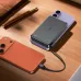 Acefast M36 22.5W 10000mAh Power Bank charging a smartphone on a wooden desk.