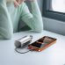 Lifestyle view of BYZ W119 22.5W 10000mAh fast charging capsule power bank charging a smartphone on a desk.