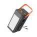 Angled view of Hoco DB49 Power Bank showing its large front LED light, top USB ports, side cables, and orange strap.