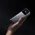 Holding in a hand the Xiaomi PB1165M 165W 10000mAh Power Bank