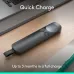 Desk view of Logitech Spotlight 2 Presenter with quick charge feature beside laptop and notebook.
