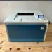 Close-up top view of HP Color LaserJet Pro 4202dw laser printer output tray and control panel.