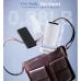 Lifestyle view of Magcubic HY300 Pro Plus Projector beside phone and bag highlighting ultra-light portable design.