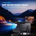 Outdoor view of Magcubic HY320 NTV Projector displaying movie on screen near tent with mountains in background.