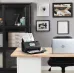 Epson WorkForce ES-580W scanner in use on a wooden desk next to a silver laptop in a home office setting.