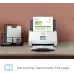 HP ScanJet Pro N4000 snw1 scanner on a desk, actively scanning an invoice document in an office setting.