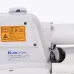 Close-up of the side of the white Jack T1377E button sewing machine with a warning label and serial number plate.
