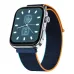 Angled close-up of the boAt Chrome Endeavour smartwatch with a silver frame and a navy/orange woven fabric strap, displaying a fitness watch face.