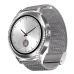 A silver smartwatch with a jeweled bezel and silver mesh band, displaying a classic silver watch face with a date window.