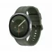 Front view of Samsung Galaxy Watch 9 with green strap showing analog clock, steps, date, and sun icon.