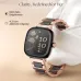 Front angled view of Titan AiRA smartwatch with floral AMOLED display showing time, steps, and heart rate.