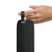 Close-up of a hand touching the loop handle on the top of the black BWOO BO-BS86 portable fabric speaker.