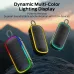Three Monster S150 Plus Portable Bluetooth Speakers glow with multicolor lights against a scenic outdoor background.