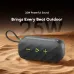 Top view of Oraimo SpaceBox Active Bluetooth Speaker on sand showing rugged design and green control buttons.