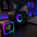 Gaming desk view of Xtrike Me SK-502 Speaker with RGB-lit setup and neon controller sign.