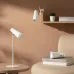 Interior view of Xiaomi Flexible Rechargeable Lamp on table, chair, and wall shelf highlighting minimalist decor.