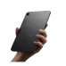 Handheld view of Xiaomi Pad Mini showing slim grey back panel with camera and compact lightweight design