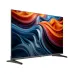 Front view of Haier H43K85GFX Google TV on angled legs displaying vivid abstract waves in blue, orange, and red.