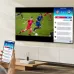 A Samsung 43Q65D TV shows a soccer game with an on-screen chat panel, and a phone displays the same screen.
