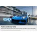 Gaming view of Samsung 77S95H OLED TV highlighting 165Hz refresh rate with motion blur racing car.