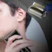 Usage view of Panasonic ES-SA40 Shaver along jawline with inset close-up of foil cutting head.
