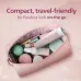 Top view of Philips BRR454/00 5000 Series Facial Hair Remover inside pink travel pouch with beauty essentials.