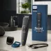 Philips BT1243-18 beard trimmer held in hand, showing textured grip, sharp blades, and green LED battery indicator.