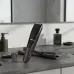 Philips BT3415/15 beard trimmer on a bathroom countertop, highlighting its ergonomic design and adjustable trimming dial.