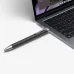 Philips DVT1600 black pen placed beside a laptop, highlighting its sleek and portable design.